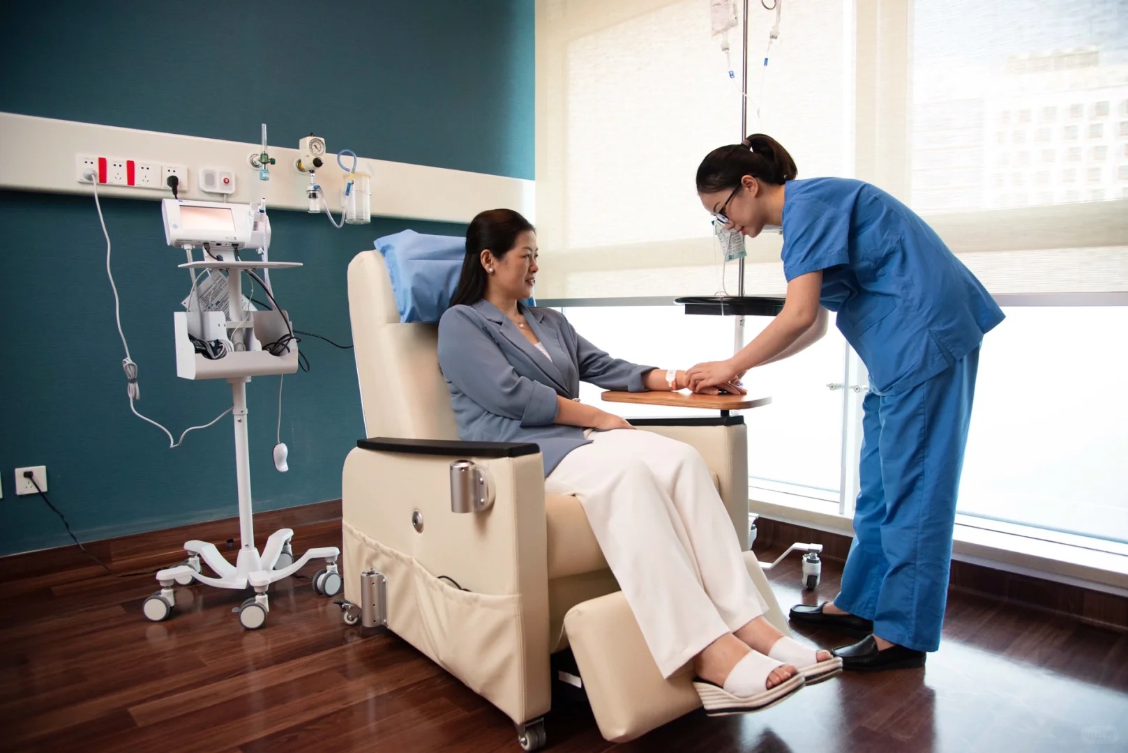 Nurse attending a patient in the day treatment infusion area at GCCC