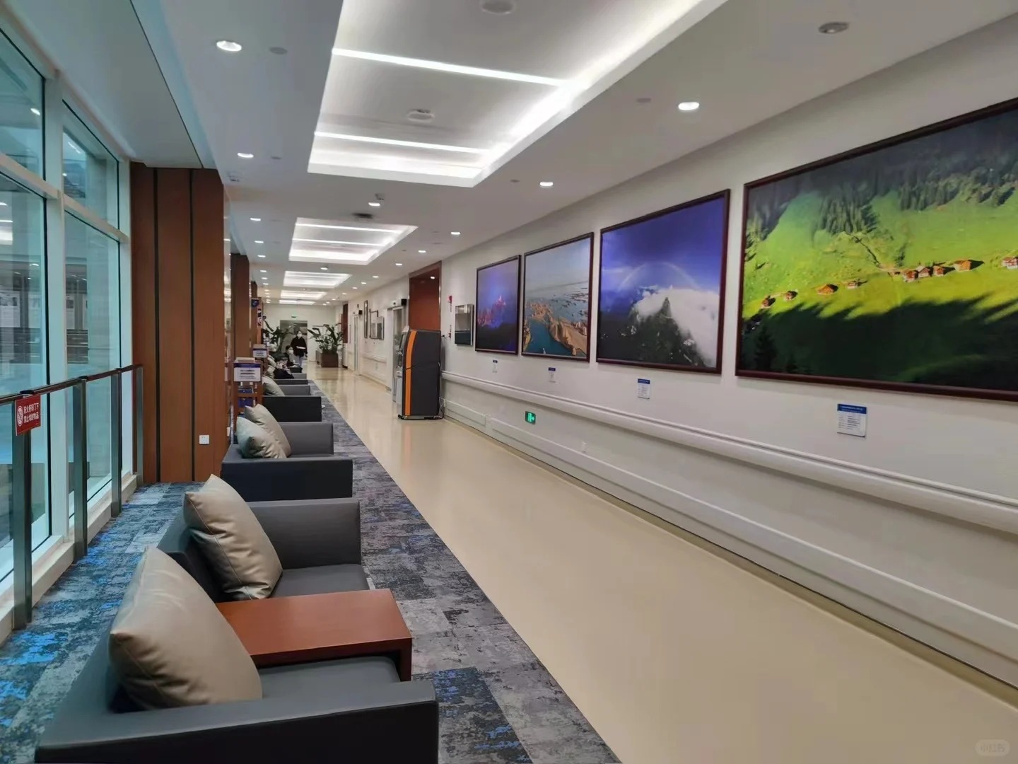 Patient corridor with seating and artwork
