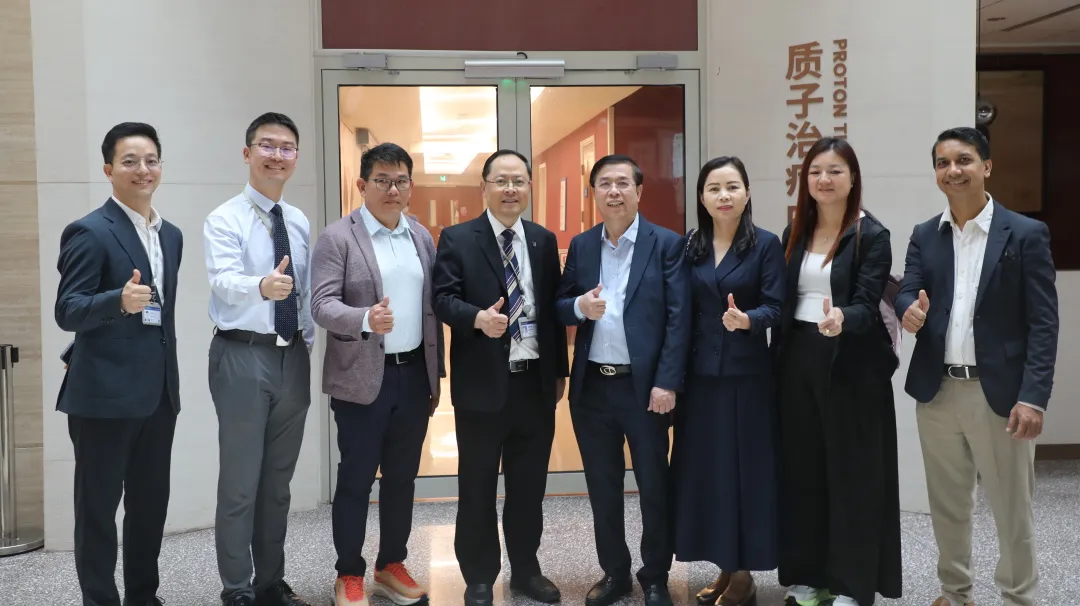 Chinese and Cambodian representatives pose at the Proton Therapy Center
